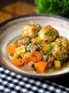 Minted lamb stew with dumplings, swede and carrots.