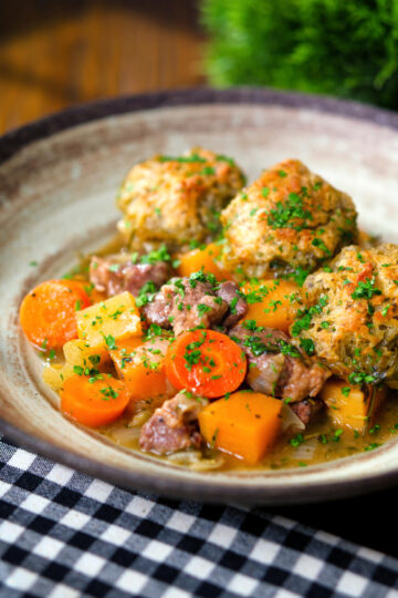 Minted lamb stew with dumplings, swede and carrots.