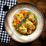 Minted lamb stew with dumplings, swede (rutabaga) and carrots.