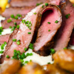 Close-up marinated steak bavette (Flank Steak) served with soubise and crushed potatoes.