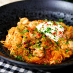 Hungarian sz&eacute;kelyk&aacute;poszta: pork belly and sauerkraut stew served with sour cream and bread.