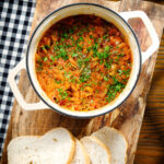 Hungarian sz&eacute;kelyk&aacute;poszta: pork belly and sauerkraut stew served in a cooking pot.