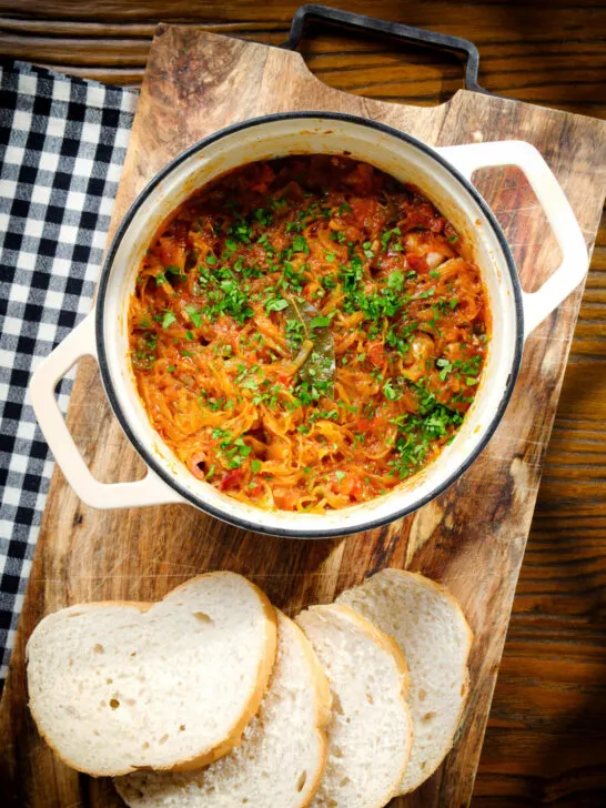 Hungarian sz&eacute;kelyk&aacute;poszta: pork belly and sauerkraut stew served in a cooking pot.