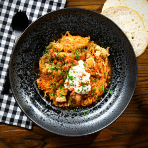 Hungarian székelykáposzta: pork belly and sauerkraut stew served with sour cream.