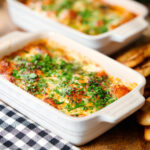 Individual Baked gnocchi alla sorrentina in a tomato and mozzarella sauce.