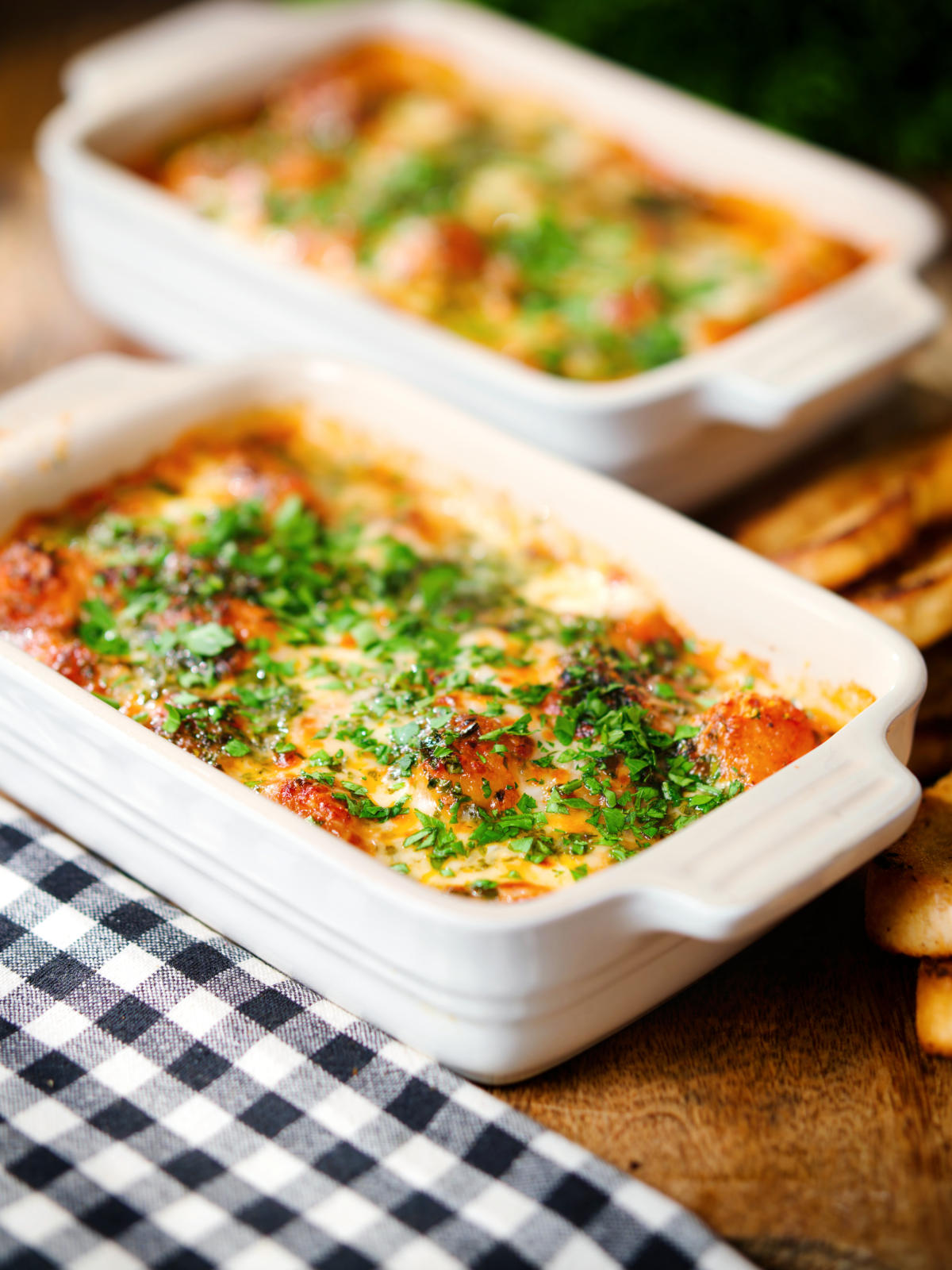 Individual Baked gnocchi alla sorrentina in a tomato and mozzarella sauce.