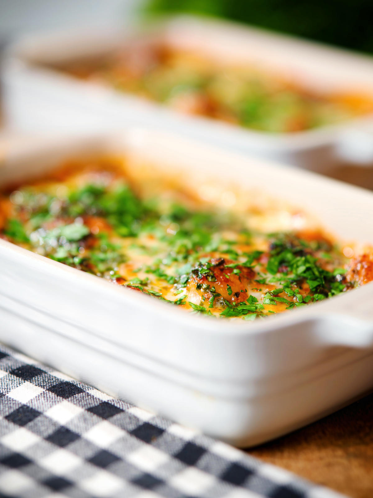 Close-up individual Baked gnocchi alla sorrentina in a tomato and mozzarella sauce.