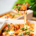 Baked gnocchi alla sorrentina being picked up with a spoon.