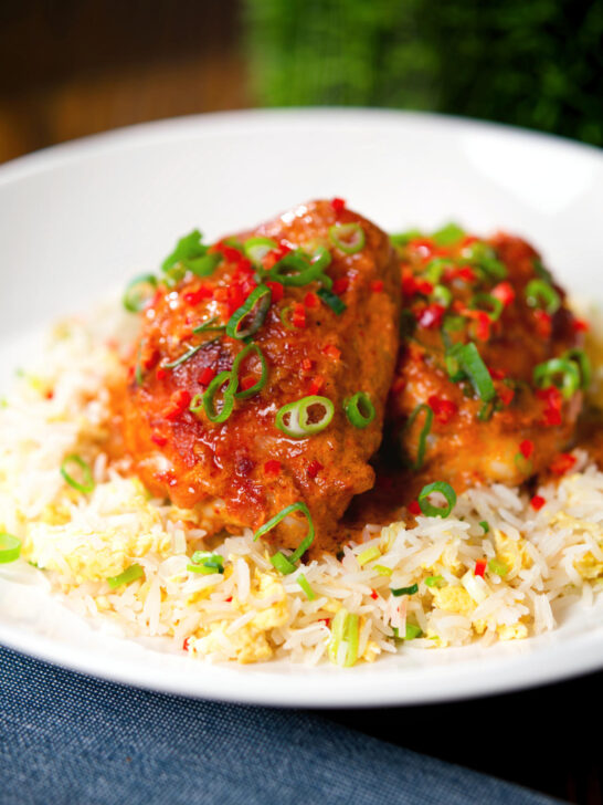 Baked Thai red curry chicken thighs served with egg fried rice.