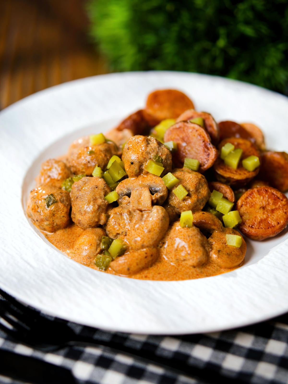 Creamy beef meatball stroganoff served with crispy fried potatoes.