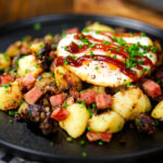 Ham, black pudding and potato hash served with a fried egg.