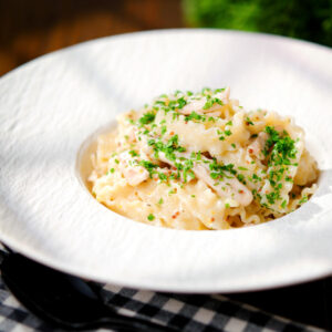 Honey and wholegrain mustard chicken pasta (malfadine) with chopped parsley.