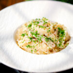 Honey and mustard chicken pasta (malfadine) with chopped parsley.