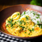 Kuku paka: African chicken curry with boiled eggs served with rice and coriander.