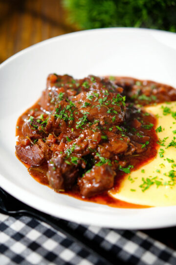 Spezzatino di manzo an Italian beef, wine and tomato stew served with polenta.