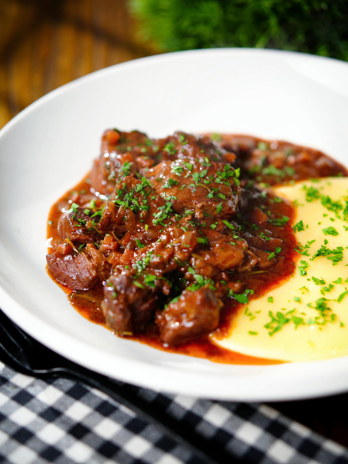 Spezzatino di manzo an Italian beef, wine and tomato stew served with polenta.