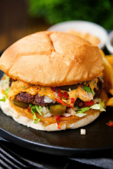 Mexican beef burger with salsa fresca, chipotle mayonnaise served with French fries.