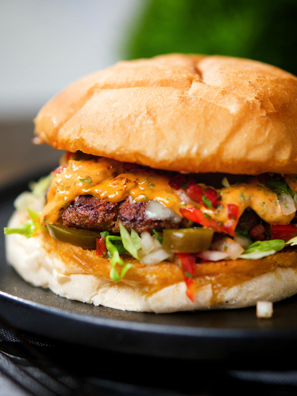 Mexican beef burger with salsa fresca, chipotle mayonnaise.