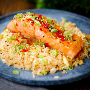 Salmon fillet baked in sweet chilli sauce served with egg fried rice.