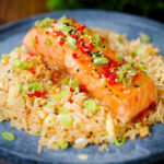 Sweet chilli sauce baked salmon with egg fried rice, fresh chilli and spring onions.