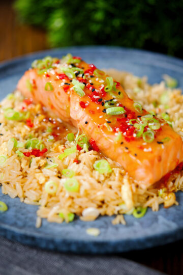 Sweet chilli sauce baked salmon with egg fried rice, fresh chilli and spring onions.