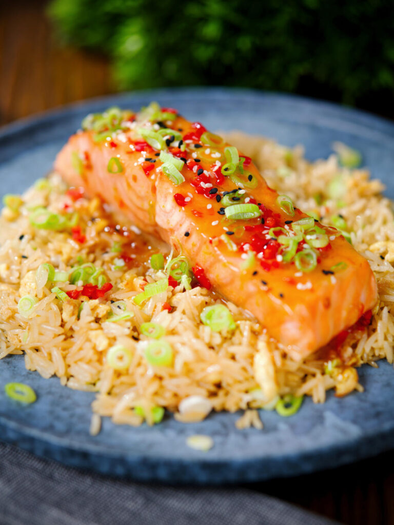 Sweet chilli sauce baked salmon with egg fried rice, fresh chilli and spring onions.