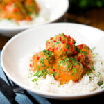 Thai red curry chicken meatballs served with white rice.