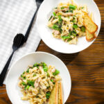 Overhead tinned mackerel, tenderstem broccoli pasta served with garlic bread.