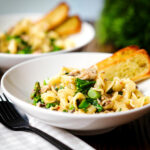 Tinned mackerel and tenderstem broccoli pasta served with garlic bread.
