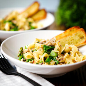 Tinned mackerel and tenderstem broccoli pasta served with garlic bread.