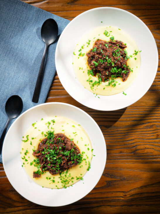 Overhead vegan mushroom ragu sauce served with creamy polenta.