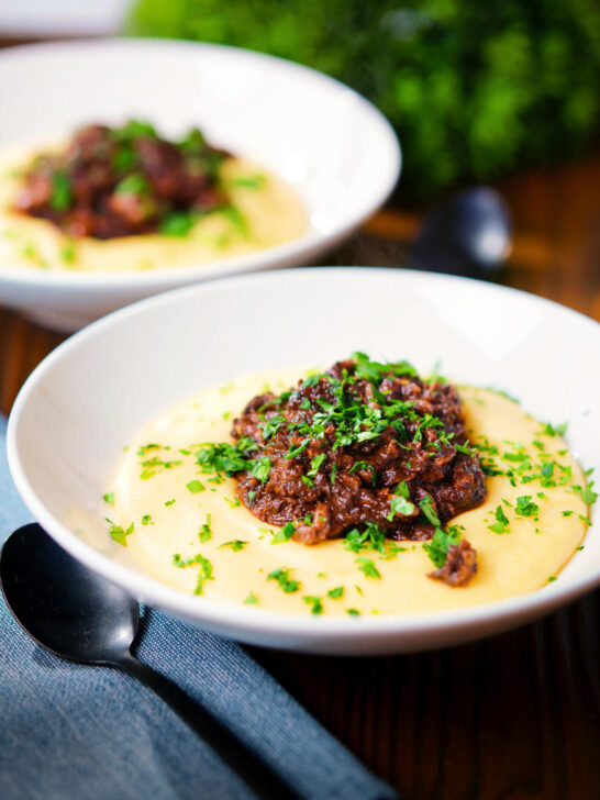 Vegan mushroom ragu sauce served with creamy polenta.