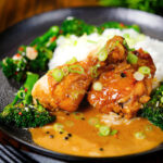 Chicken adobo with coconut milk (Adobong Manok sa Gata) served with stir fried broccoli and rice.