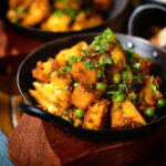 Indian aloo gobi matar ki sabzi: Dry vegan potato, cauliflower and pea curry.