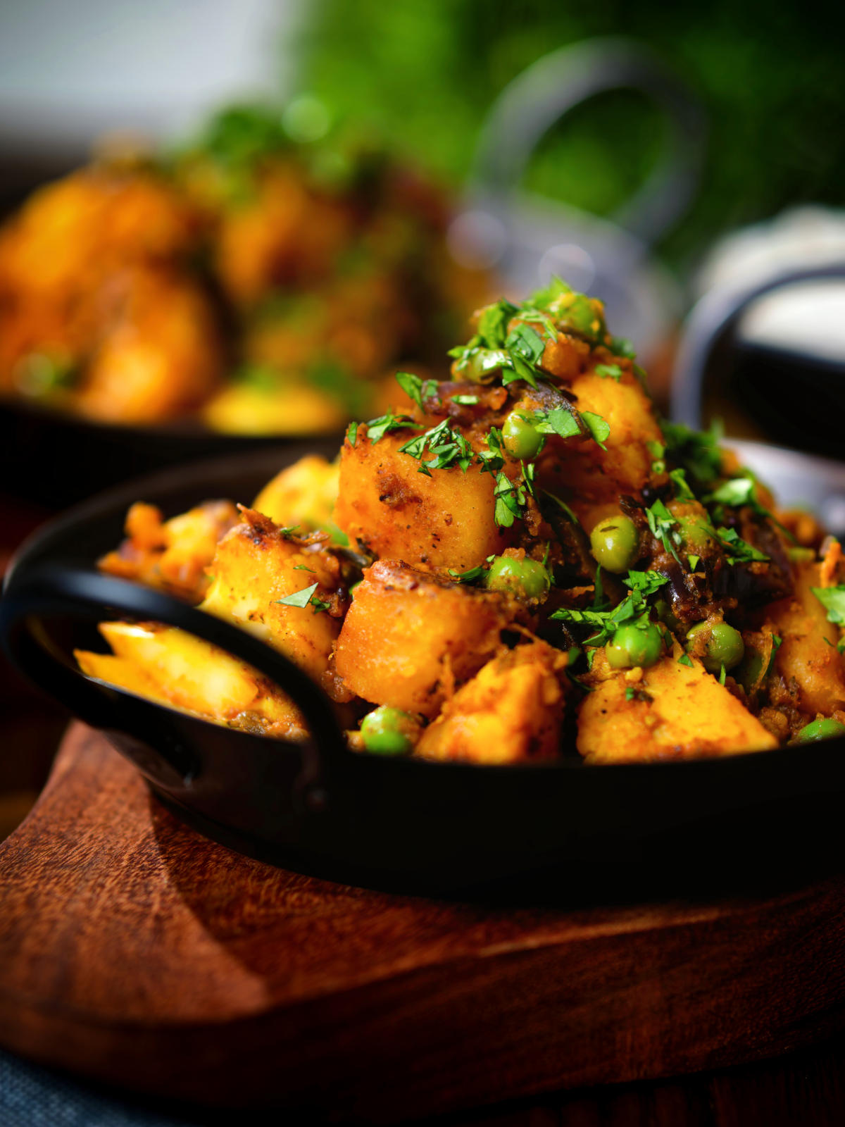 Close-up Indian aloo gobi matar ki sabzi: Dry vegan potato, cauliflower and pea curry.