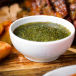 Homemade mint sauce in a white bowl.