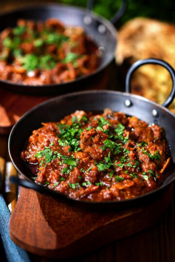Keralan style beef curry served with fresh coriander and naan bread.