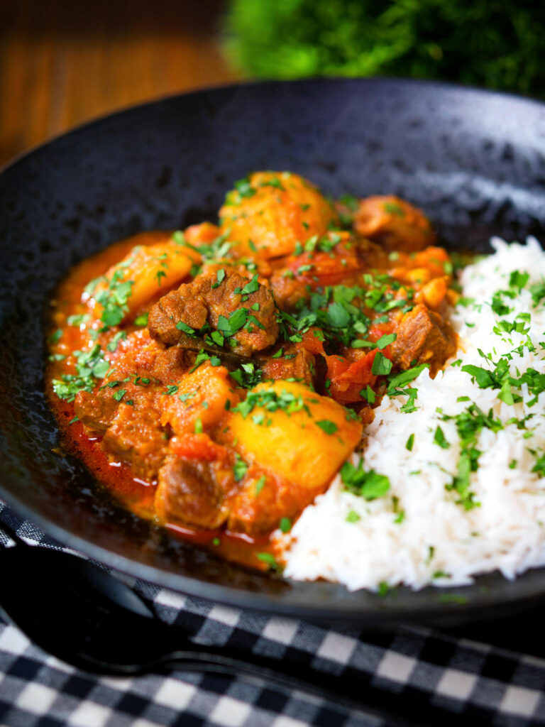 South African influenced lamb and potato Durban curry served with rice.
