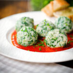Italian Malfatti; spinach and ricotta dumplings served with tomato sauce and garlic baguette.