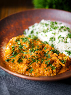 Indian nawabi chicken curry with basmati rice and coriander.