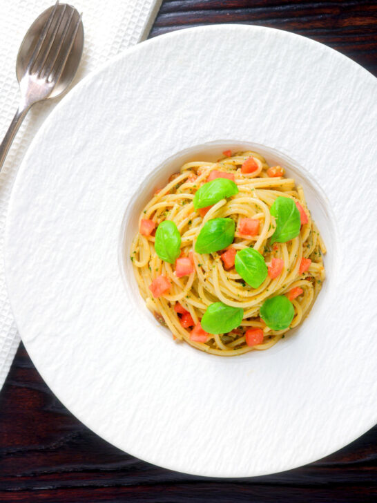 Overhead Sicilian pesto alla trapanese served with spaghetti.