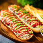 Polish cheese and mushroom zapiekanka open sandwich served with ketchup and fries.