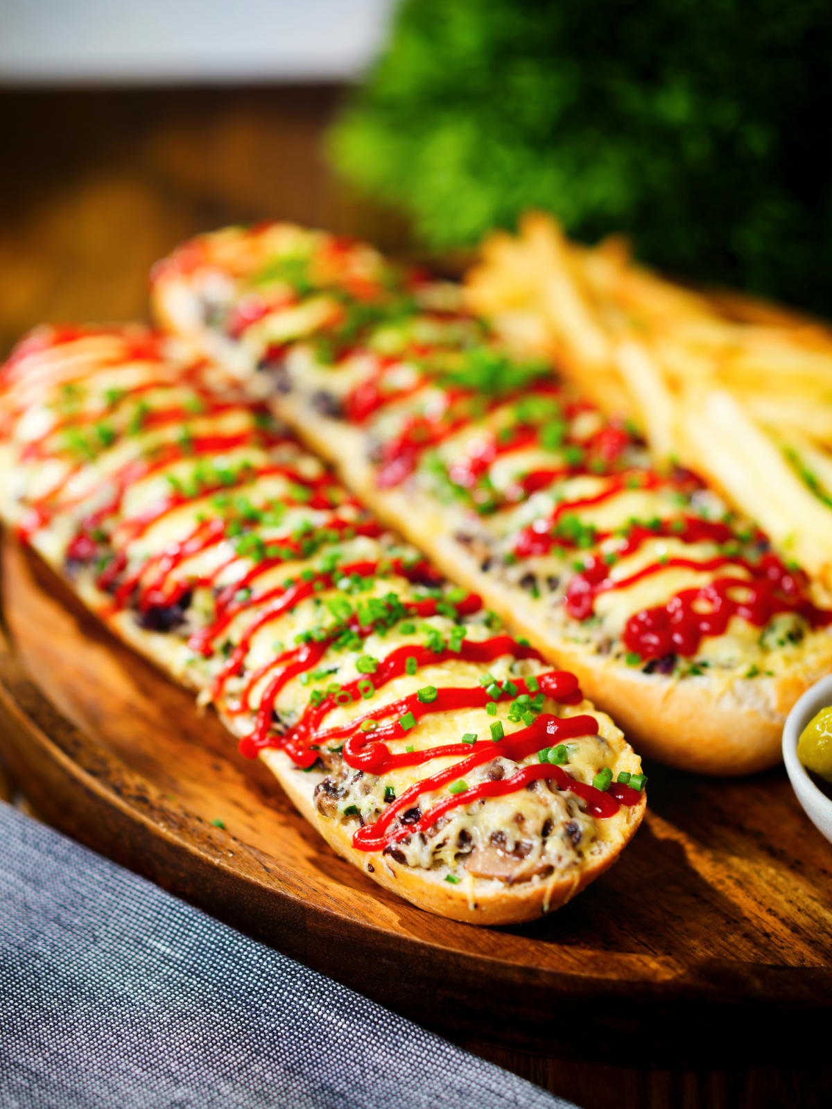 Polish cheese and mushroom zapiekanka open sandwich served with ketchup and fries.