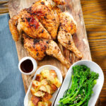 Overhead spatchcock chicken alla diavola with Parmentier potatoes and tenderstem broccoli.