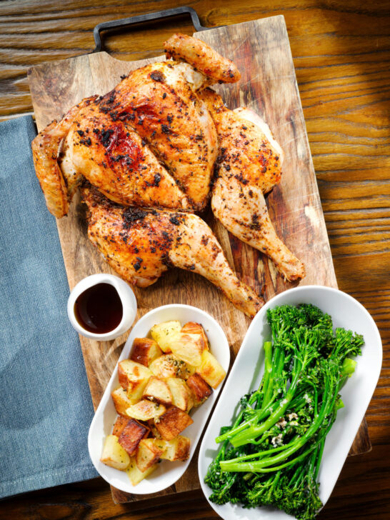 Overhead spatchcock chicken alla diavola with Parmentier potatoes and tenderstem broccoli.