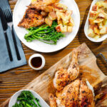 Overhead spatchcock chicken alla diavola with Parmentier potatoes and tenderstem broccoli.