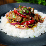 Chinese Xinjiang lamb stir fry with cumin, dried chillies and red onion served with jasmine rice.