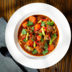 Mì Bò Kho (mi bo kho), Vietnamese beef and egg noodle stew with carrots and spring onions.