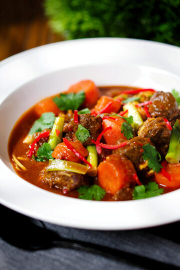 Mì Bò Kho, Vietnamese beef and egg noodle stew with carrots and spring onions.
