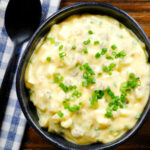 Overhead French sauce gribiche garnished with snipped chives.